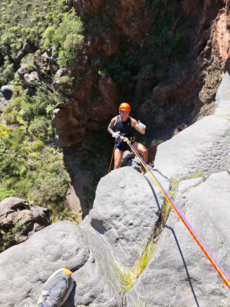 Dry canyoning abseil on volcanic rock